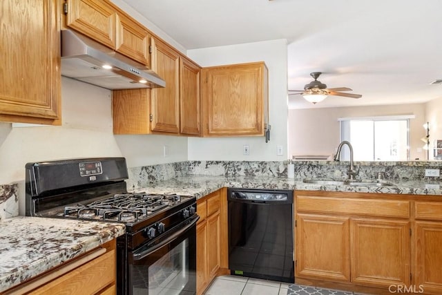 11530 Oak St, Apple Valley, CA 92308 - kitchen featuring black appliances, range hood, a sink, a ceiling fan, and light stone counters