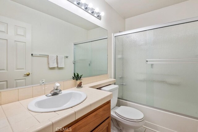 11530 Oak St, Apple Valley, CA 92308 - bathroom with toilet, vanity, and shower / bath combination with glass door