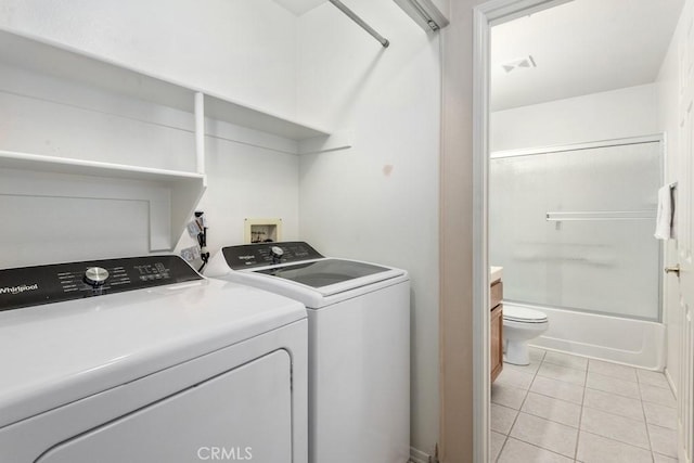 11530 Oak St, Apple Valley, CA 92308 - washroom featuring washing machine and dryer and light tile patterned floors