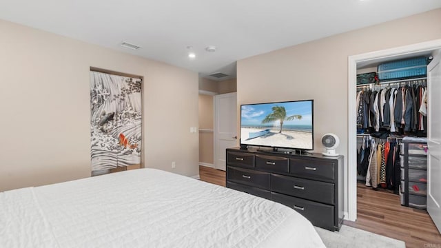 1771 Laurelwood Way, Oceanside, CA 92056 - bedroom featuring a spacious closet, wood finished floors, a closet, and recessed lighting