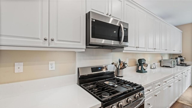 1771 Laurelwood Way, Oceanside, CA 92056 - kitchen featuring stainless steel appliances, white cabinets, and light countertops
