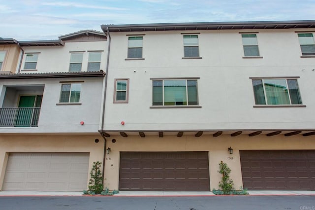 1771 Laurelwood Way, Oceanside, CA 92056 - back of house featuring stucco siding and an attached garage