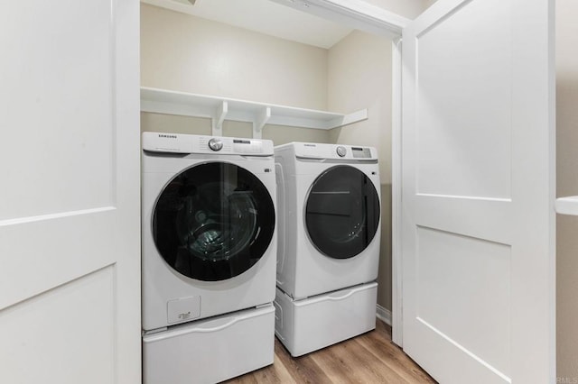 1771 Laurelwood Way, Oceanside, CA 92056 - washroom featuring washer and dryer and wood finished floors