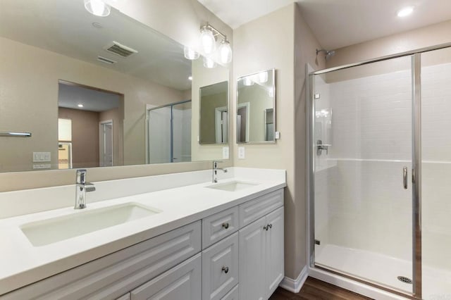 1771 Laurelwood Way, Oceanside, CA 92056 - full bathroom with a shower stall, double vanity, and wood finished floors