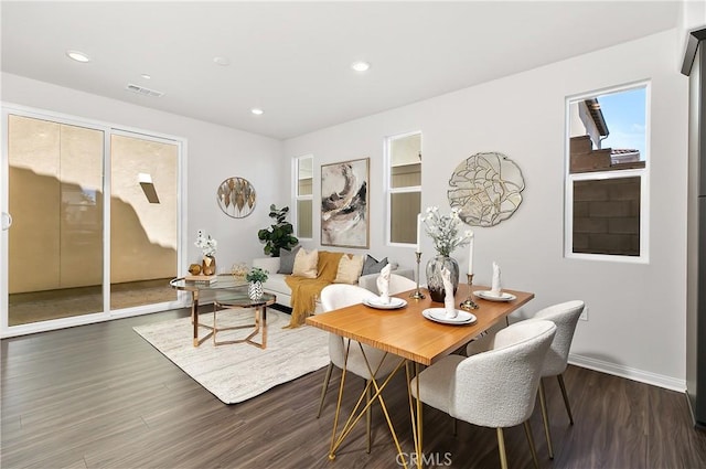 dining space with dark wood-style flooring, visible vents, baseboards, and recessed lighting