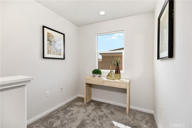 hall with carpet flooring and baseboards