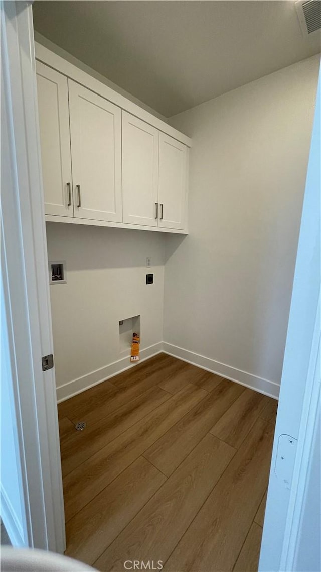 230 Sora, Irvine, CA 92618 - laundry area featuring baseboards, dark wood-style flooring, cabinet space, electric dryer hookup, and hookup for a washing machine