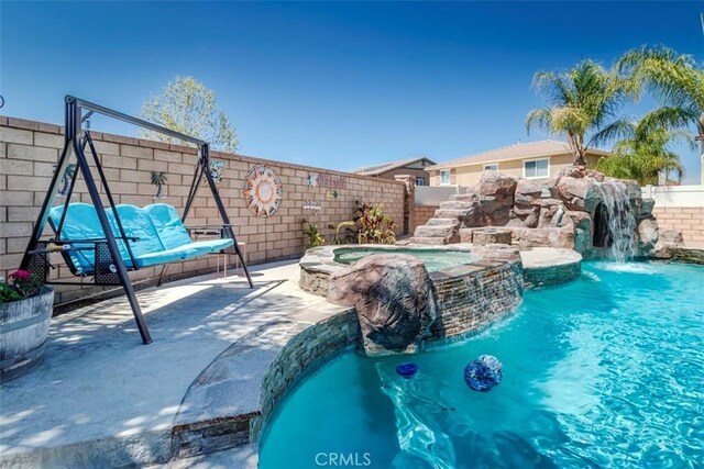 25279 Spur Branch Pl, Menifee, CA 92584 - view of pool with a fenced backyard, a patio, and a pool with connected hot tub
