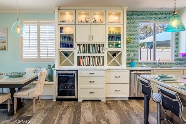 25279 Spur Branch Pl, Menifee, CA 92584 - office space featuring wine cooler, a sink, healthy amount of natural light, dark wood-style flooring, and ornamental molding
