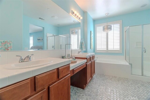 25279 Spur Branch Pl, Menifee, CA 92584 - bathroom featuring a shower stall, double vanity, a bath, and tile patterned floors