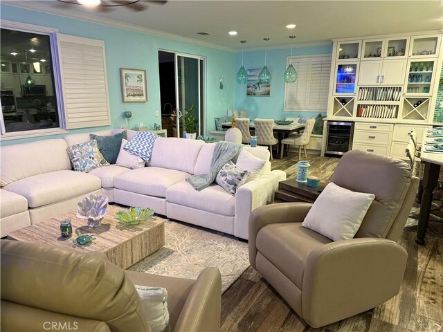 25279 Spur Branch Pl, Menifee, CA 92584 - living room with wine cooler, crown molding, wood finished floors, and recessed lighting