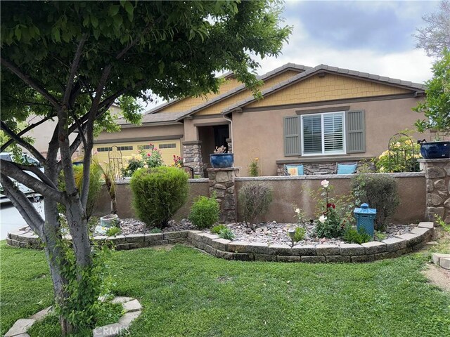 25279 Spur Branch Pl, Menifee, CA 92584 - view of front of property with stone siding, a front lawn, and stucco siding