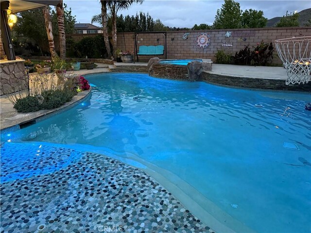 25279 Spur Branch Pl, Menifee, CA 92584 - view of swimming pool with a pool with connected hot tub