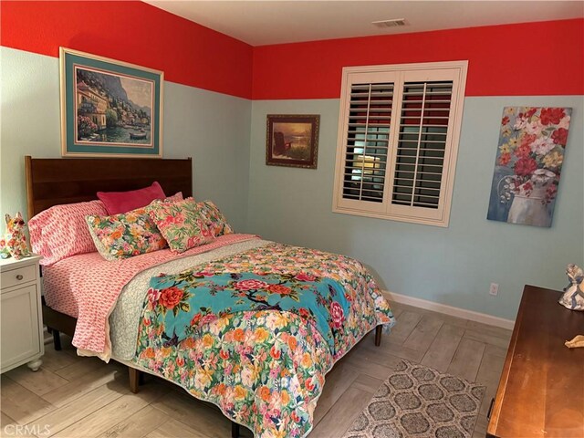 25279 Spur Branch Pl, Menifee, CA 92584 - bedroom featuring baseboards and wood finished floors