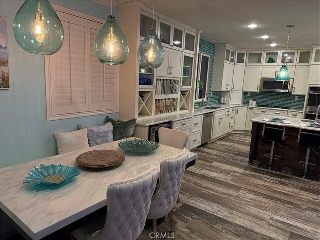 25279 Spur Branch Pl, Menifee, CA 92584 - dining space with dark wood-style floors and recessed lighting