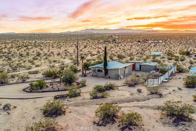 63854 Orion Rd, Joshua Tree, CA 92252 - aerial view at dusk of view of desert landscape, a mountain view, and a view of rural / pastoral area