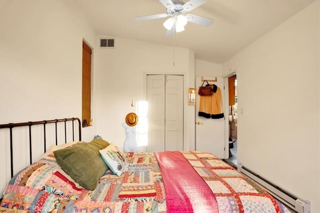 63854 Orion Rd, Joshua Tree, CA 92252 - bedroom featuring baseboard heating, lofted ceiling, a closet, and a ceiling fan