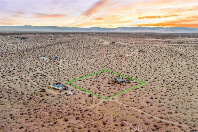 63854 Orion Rd, Joshua Tree, CA 92252 - aerial view of property and surrounding area with a mountain backdrop and property boundaries highlighted