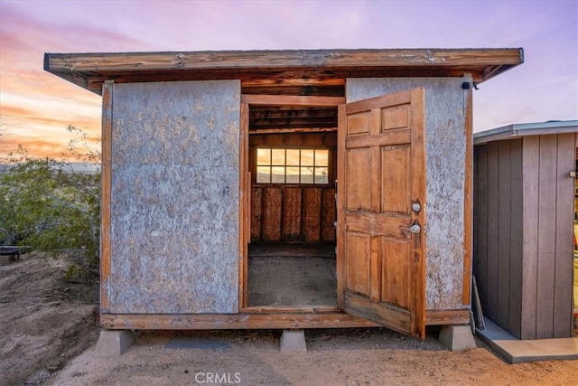 63854 Orion Rd, Joshua Tree, CA 92252 - outdoor structure at dusk with a shed