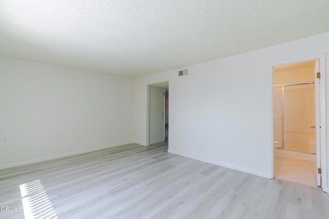 500 Jackson Pl Unit 313, Glendale, CA 91206 - spare room with light wood-style flooring and a textured ceiling