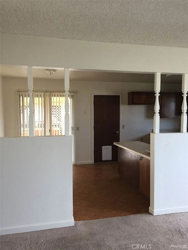 kitchen with carpet and baseboards