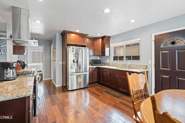 1257 S G St, Oxnard, CA 93033 - kitchen with dark wood-style flooring, island exhaust hood, light stone countertops, a sink, and stainless steel appliances