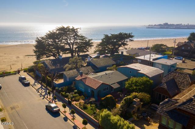 aerial view with a water view and a view of the beach