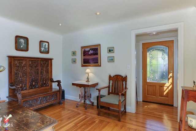 entryway with light wood-type flooring and baseboards