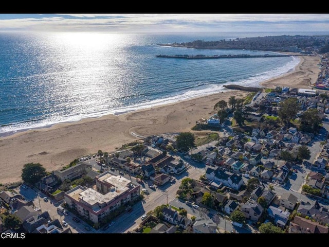 birds eye view of property with a beach view and a water view