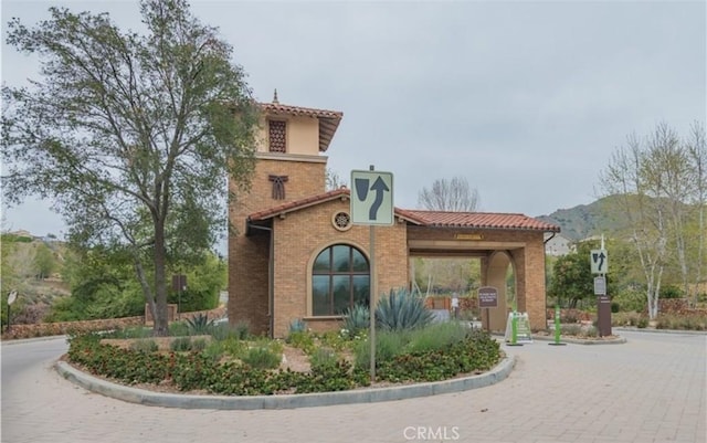 exterior space with a mountain view and brick siding