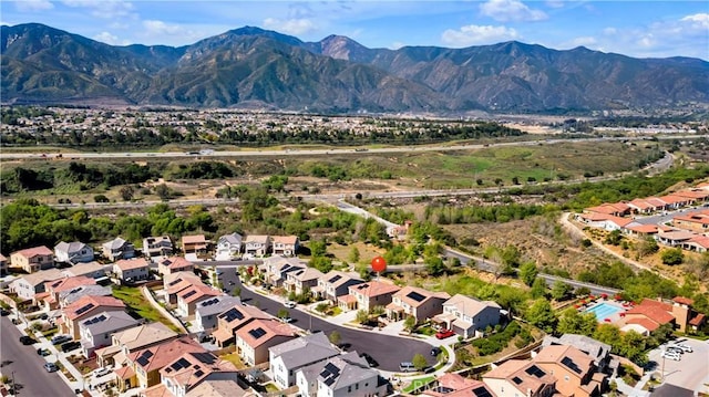 aerial view with a mountain view and a residential view