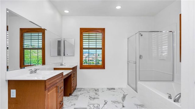 full bathroom with vanity, a shower stall, a bath, and marble finish floor
