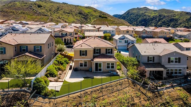 birds eye view of property featuring a mountain view and a residential view