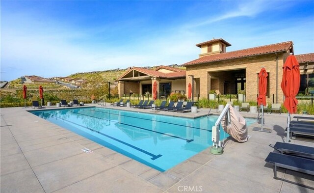 pool with a patio