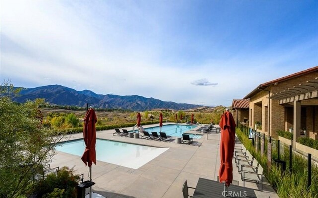 24845 Elison Ct, Corona, CA 92883 - community pool with a mountain view, a patio, and fence