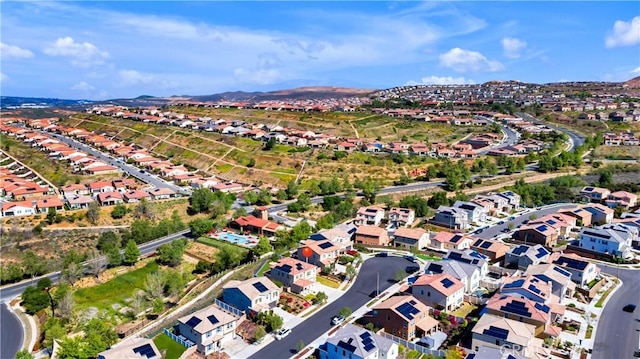 birds eye view of property featuring a mountain view and a residential view