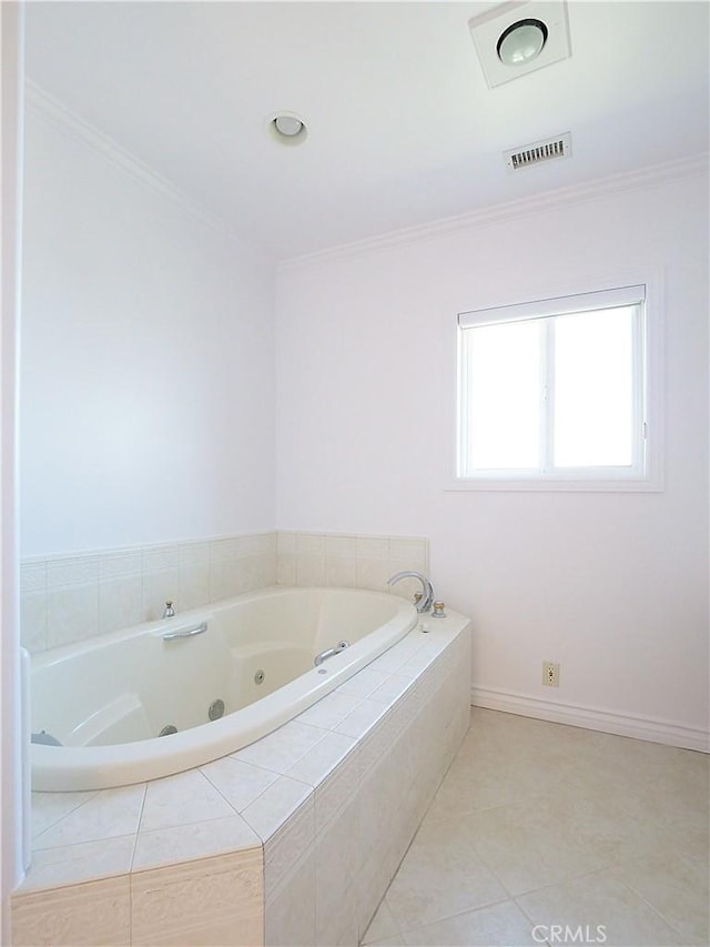 bathroom with tile patterned floors, a whirlpool tub, ornamental molding, and visible vents