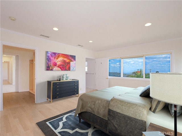 bedroom featuring visible vents, ornamental molding, recessed lighting, and light wood-style floors