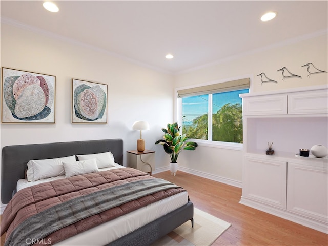 bedroom featuring recessed lighting, light wood-style floors, and ornamental molding