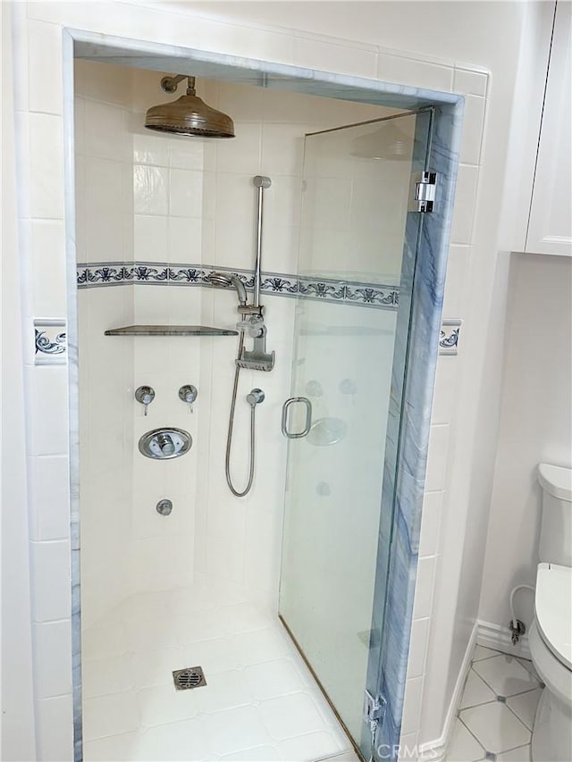 26235 Birchfield Ave, Rancho Palos Verdes, CA 90275 - bathroom featuring a stall shower, toilet, and tile patterned flooring