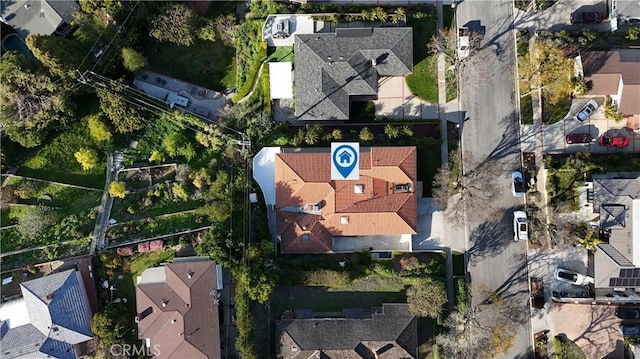 birds eye view of property with a residential view