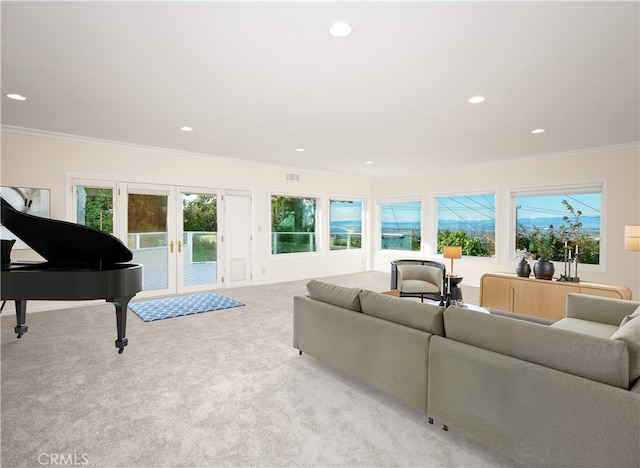 living area featuring french doors, recessed lighting, ornamental molding, and carpet floors