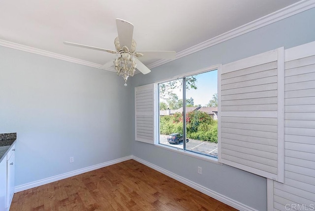 17159 W Bernardo Dr Unit 202, San Diego, CA 92127 - unfurnished dining area featuring a ceiling fan, baseboards, crown molding, and wood finished floors