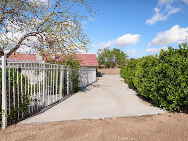 surrounding community featuring fence and a gate