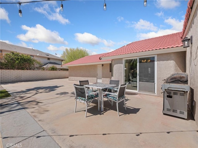 view of patio / terrace with outdoor dining area and a grill