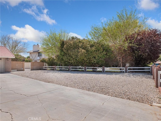 view of yard featuring a gate and a fenced front yard