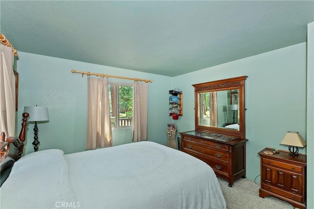 bedroom featuring light colored carpet