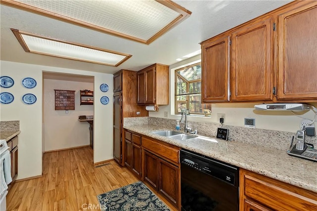 kitchen with range, light wood-style floors, dishwasher, a sink, and brown cabinets