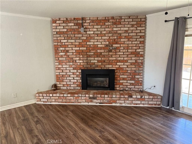 500 Sherri Way, Turlock, CA 95382 - detailed view of wood finished floors, crown molding, a brick fireplace, and baseboards