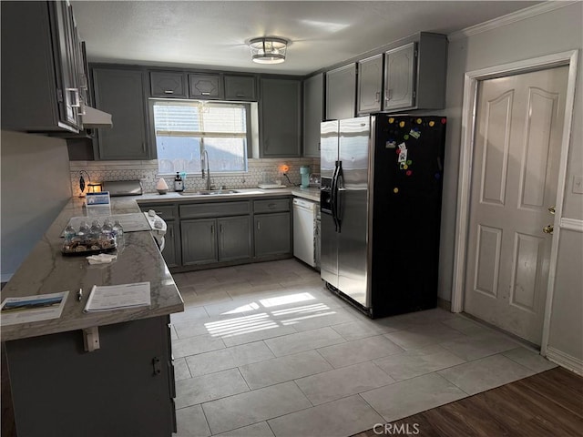 500 Sherri Way, Turlock, CA 95382 - kitchen with stainless steel fridge with ice dispenser, a sink, backsplash, crown molding, and under cabinet range hood